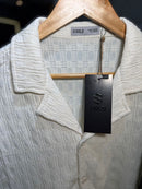 Camiseta de botão S Gold texturizada  229,99 Por 189,90